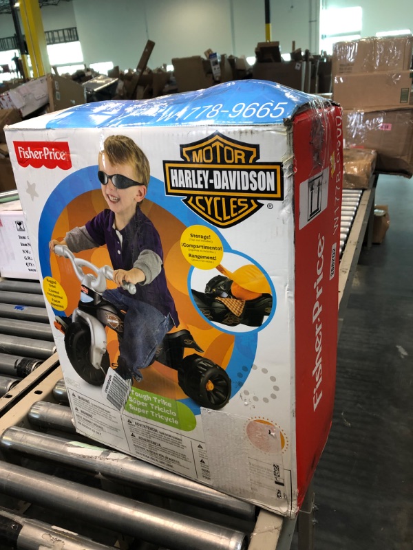 Photo 2 of Fisher-Price Harley-Davidson Tricycle with Handlebar Grips and Storage Area, Multi-Terrain Tires, Tough Trike [Amazon Exclusive]