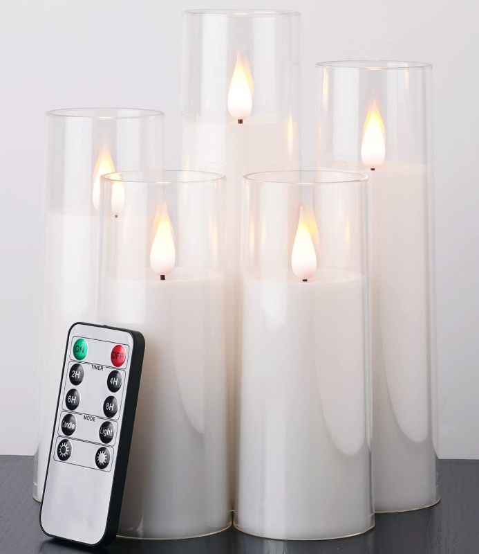 Photo 1 of Amagic Pure White Flameless Candles, Battery Operated Candles, Flickering LED Pillar Candles with Remote Control and Timer, 3D Wick, Yellow and Blue Glow, Set of 4