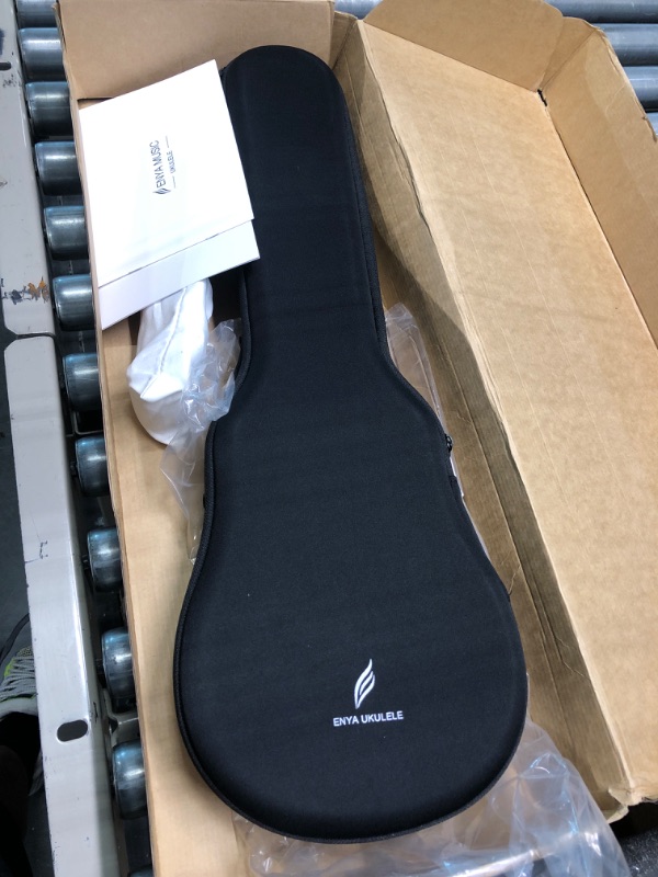 Photo 2 of Enya Concert Ukulele Nova U 23 Carbon Fiber Travel Ukulele with Beginner Kit Includes Online Lessons, Case, Strap, Capo and Strings (Black)