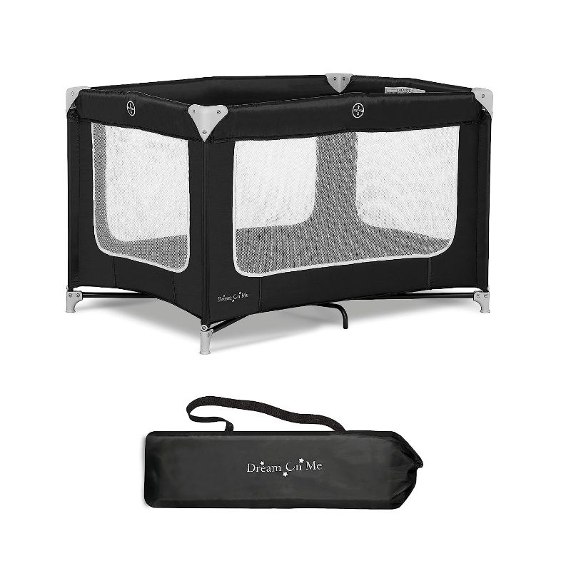 Photo 1 of Dream On Me Zodiak Portable Playard in Black, Lightweight, Packable and Easy Setup Baby Playard, Breathable Mesh Sides and Soft Fabric - Comes with a Removable Padded Mat
