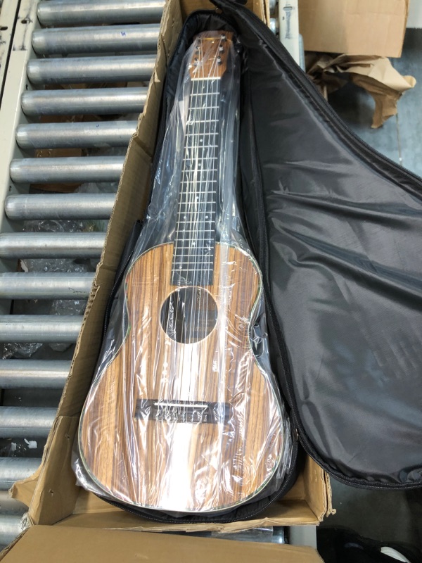 Photo 1 of Caramel 6 String CB103G 30 Inch High Gloss Zebra Wood Acoustic & Electric Ukulele Guitalele with Truss Rod with Padded Gig Bag, Strap and Wall hanger
