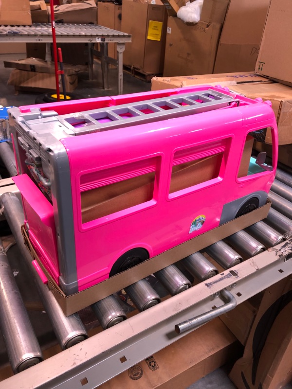 Photo 5 of Barbie Camper Playset, Dreamcamper Toy Vehicle with 60 Accessories Including Furniture, Pool and 30-Inch Slide