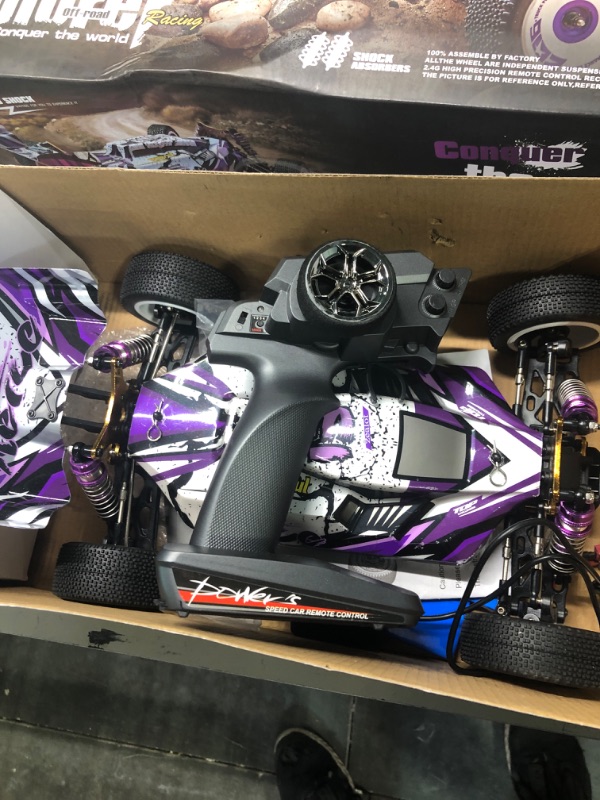 Photo 3 of GoolRC WLtoys 124019 RC Car, 1/12 Scale 2.4GHz Remote Control Car, 4WD 60km/h High Speed Racing Car, Off-Road Buggy Drift Car RTR with Aluminum Alloy Chassis, Zinc Alloy Gear and 1 Battery