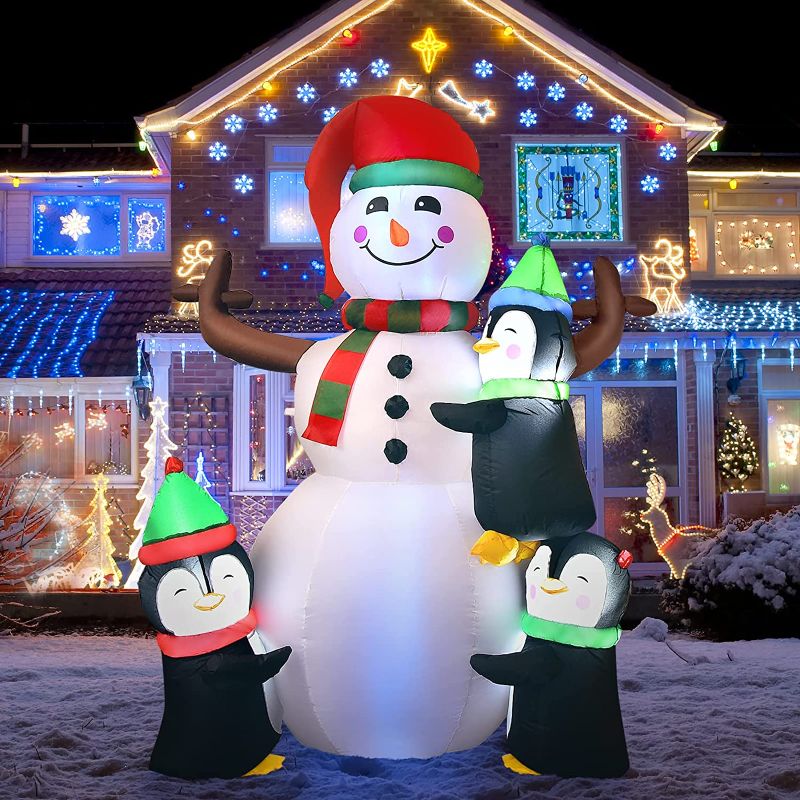 Photo 1 of 6 FT Christmas Inflatable Snowman with 3 Penguins, Outdoor Xmas Blow Up Snowman w/Bright Lights, Built-in Sand Bag