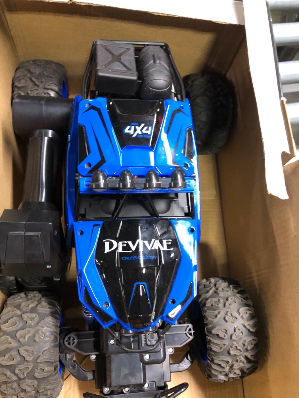 Photo 1 of CROBOLL 1:12 Large Remote Control Car for Boys Kids with Lifting Function,4WD RC Cars Electric Monster Truck Toy Gifts 4X4 Off-Road RC Rock Crawler 2.4GHz All Terrain RC Truck with 2 Batteries(Blue)