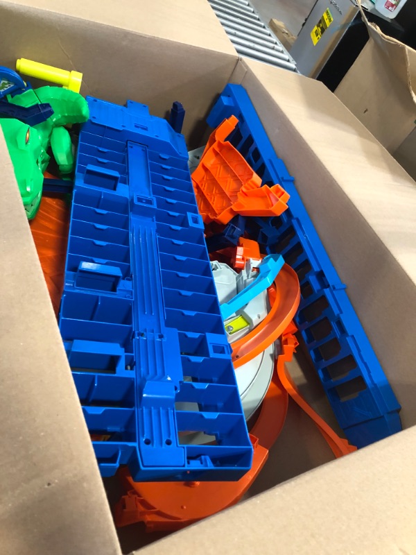 Photo 1 of Hot Wheels Track Set, Ultimate Garage Toy Vehicle Playset With Moving T-Rex Dinosaur, Storage For 100+ Vehicles, 3ft+ Tall