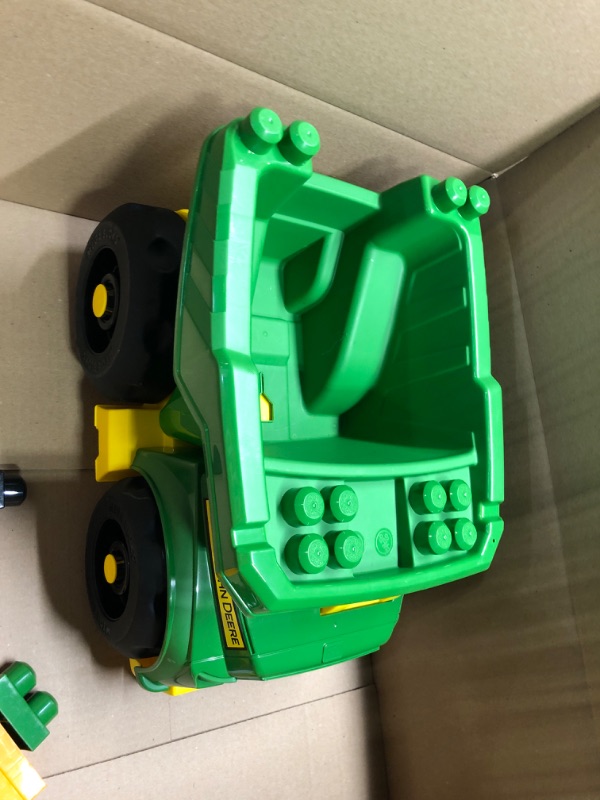 Photo 1 of John Deere dump truck with blocks