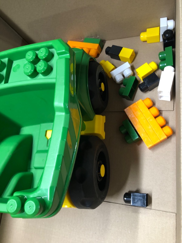 Photo 1 of John Deere dump truck with blocks