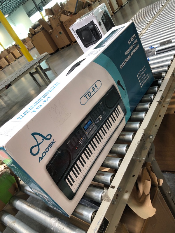 Photo 1 of AODSK 61 Key Keyboard Piano+X-Style Keyboard Stand Adjustable Width & Height