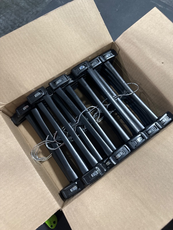 Photo 1 of Titan Mall Pants Hangers 30 Pack 12inch Black Plastic Skirt Hanger with Non-Slip Big Clips and 360 Rotatable Hook, Durable and Sturdy Plastic Hanger, Elegant and Economical for Hanging Pants or Skirts