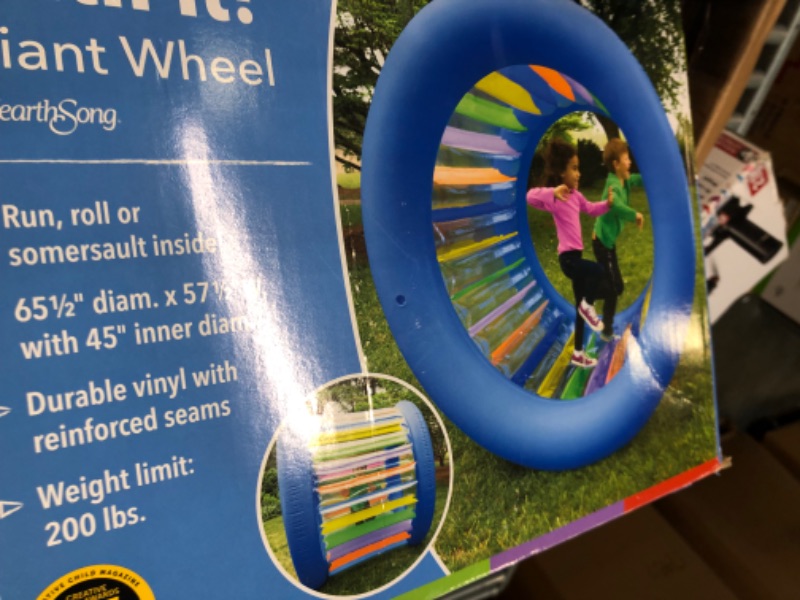 Photo 3 of HearthSong Roll With It! Giant Inflatable Colorful Rolling Wheel for Active Outdoor Play, 45" Diam., Holds up to 200 Lbs.