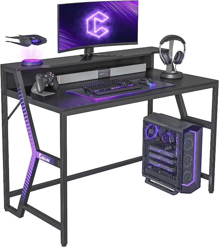 Photo 1 of CubiCubi Carrier Gaming Desk 47 inch Gamer Workstation, Home Computer Carbon Fiber Surface Gaming Desk PC Table with Monitor Stand
