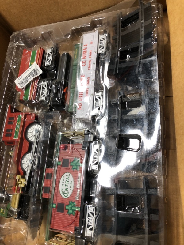 Photo 1 of Lionel North Pole Central Battery-Powered Train Set with Remote + Inner Loop Track Expansion Pack Complete Set + Expansion Track (Inner Loop)