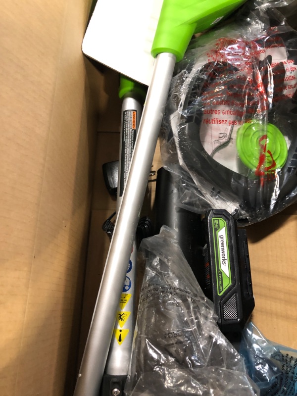 Photo 1 of Greenworks 24V Cordless String Trimmer and Blower Combo Pack with Extra Replacement Spools, 2Ah Battery and Charger Included