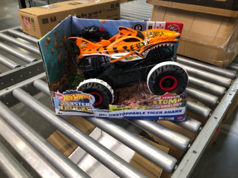 Photo 6 of Hot Wheels Monster Trucks, Remote Control Car, Monster Truck Toy with All-Terrain Wheels, 1:15 Scale Unstoppable Tiger Shark RC