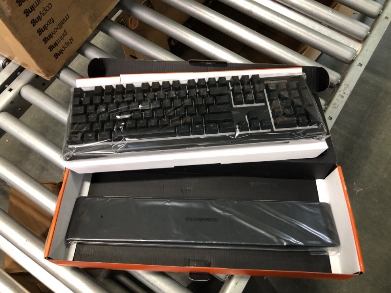 Photo 1 of SteelSeries Apex 3 RGB Gaming Keyboard – 10-Zone RGB Illumination – IP32 Water Resistant – Premium Magnetic Wrist Rest (Whisper Quiet Gaming Switch)