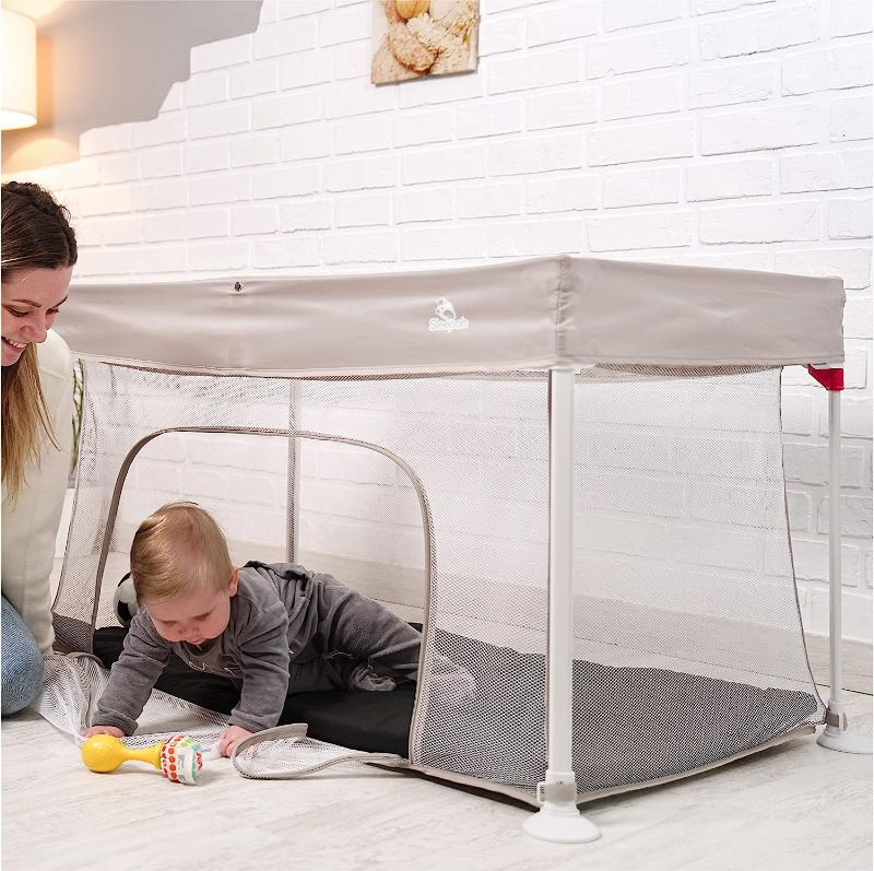 Photo 1 of Sleepah Foldable Travel Crib – Lightweight Portable Play Pen + Backpack, Play-Yard with Waterproof Mattress – Easy to Pack Fits in a Suitcase, Sets up in 30 Seconds Safe for Infants & Toddlers (Beige)
