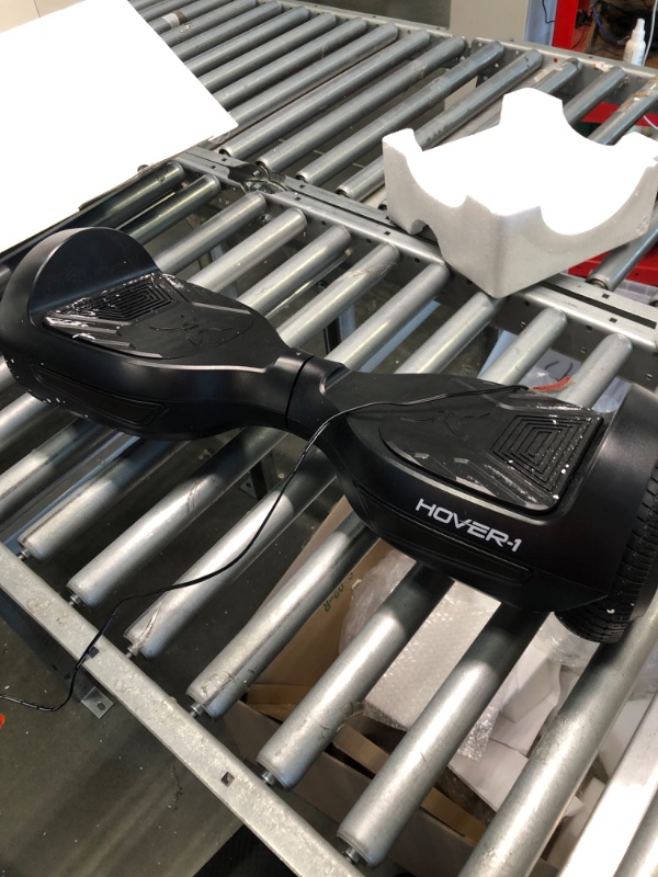 Photo 1 of Hover-1 Drive Electric Hoverboard | 7MPH Top Speed, 3 Mile Range, Long Lasting Lithium-Ion Battery, 6HR Full-Charge, Path Illuminating LED Lights Black