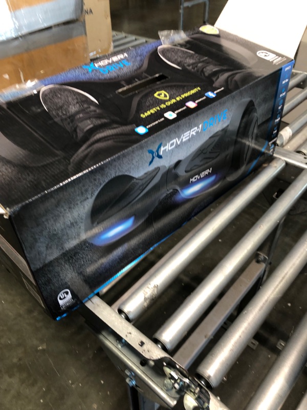 Photo 1 of Hover-1 Drive Electric Hoverboard | 7MPH Top Speed, 3 Mile Range, Long Lasting Lithium-Ion Battery, 6HR Full-Charge, Path Illuminating LED Lights Black