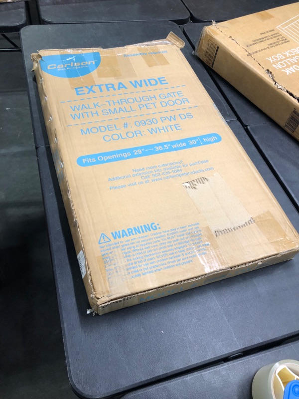 Photo 2 of Carlson Extra Wide Walk Through Pet Gate with Small Pet Door, Includes 4-Inch Extension Kit, Pressure Mount Kit and Wall Mount Kit