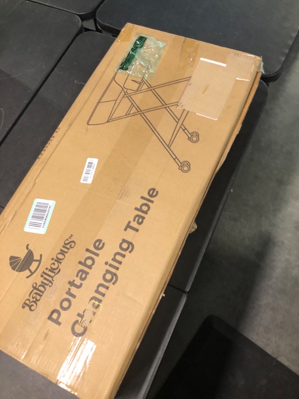 Photo 1 of Babylicious Baby Portable Changing Table - Foldable Changing Table with Wheels - Portable Diaper Changing Station - Adjustable Height Baby Changing Table-Safety Belt and Large Storage Rack for Infants