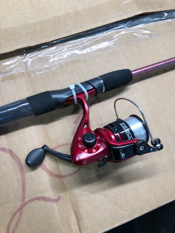 Photo 4 of Zebco Slingshot Spinning Reel and Fishing Rod Combo, 2-Piece Medium-Light Durable Fiberglass Rod, Comfortable EVA Handle, Pre-Spooled with 8-Pound Cajun Fishing Line 6'0" Rod - Red