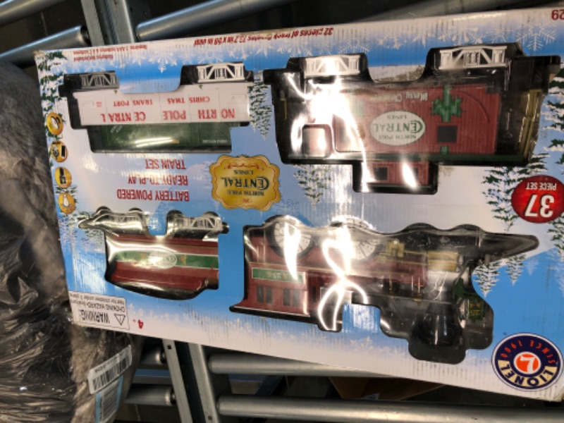 Photo 1 of Lionel North Pole Central Battery-Powered Train Set with Remote + Inner Loop Track Expansion Pack Complete Set + Expansion Track (Inner Loop)