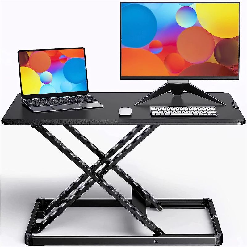 Photo 1 of ErGear Standing Desk Converter Height Adjustable Stand Up Desktop Riser, 28" Ergonomic Gas Spring Sit to Stand Workstation for Laptop and Monitor Home Office (EGSSD4)