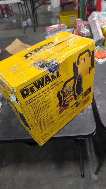 Photo 2 of DEWALT DXAEPS14 1600 Peak Battery Amp 12V Automotive Jump Starter/Power Station with 500 Watt AC Power Inverter, 120 PSI Digital Compressor, and USB Power , Yellow