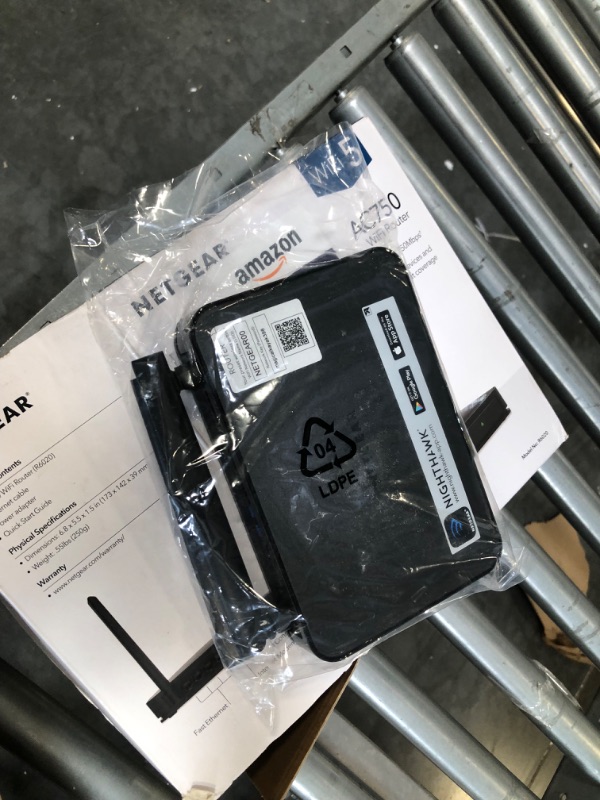 Photo 1 of NETGEAR Dual Band WiFi Router (R6020) – AC750 Wireless Speed (Up to 750Mbps), Coverage up to 750 sq. ft, 10 Devices, 4 x Fast Ethernet Ports