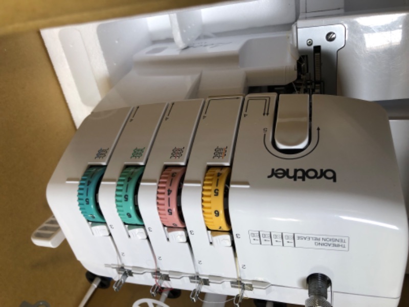 Photo 1 of Brother Serger, 1034D, Heavy-Duty Metal Frame Overlock Machine, 1,300 Stitches Per Minute, Removeable Trim Trap, 3 Included Accessory Feet,White
