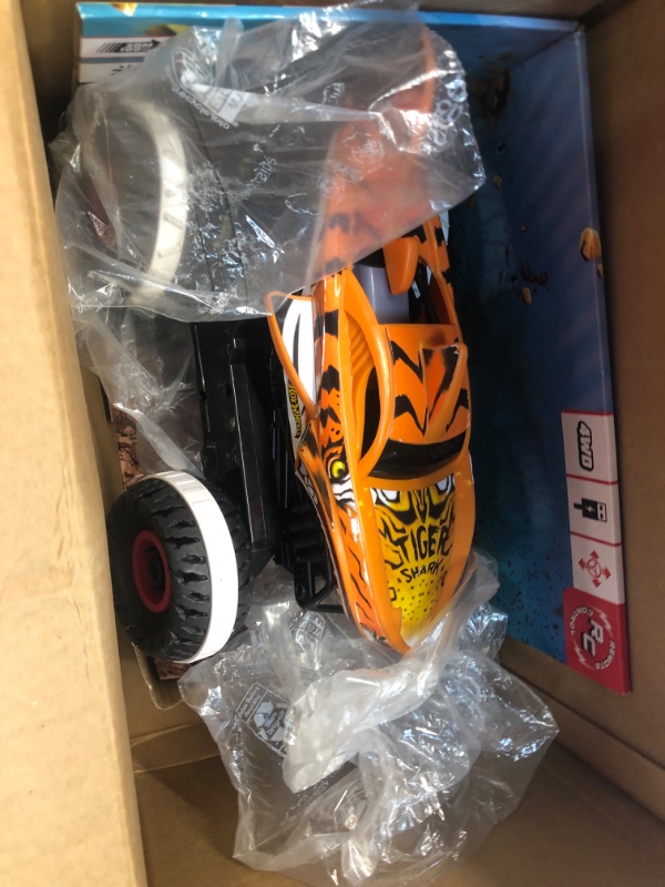 Photo 1 of Hot Wheels Monster Trucks, Remote Control Car, Monster Truck Toy with All-Terrain Wheels, 1:15 Scale Unstoppable Tiger Shark RC