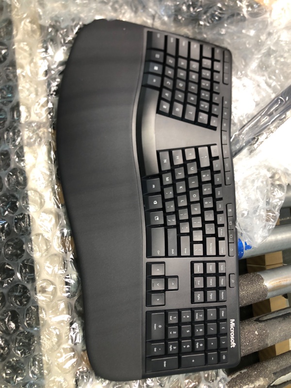 Photo 3 of Microsoft Ergonomic Keyboard - Black. Wired, Comfortable, Ergonomic Keyboard with Cushioned Wrist and Palm Support. Split Keyboard. Dedicated Office Key.