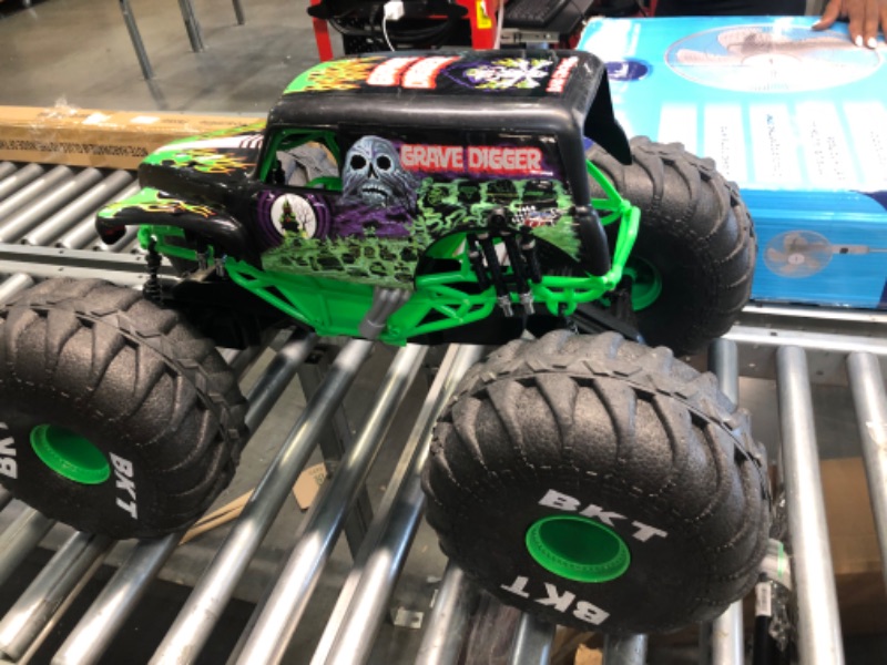 Photo 3 of Losi RC Truck LMT 4 Wheel Drive Solid Axle Monster Truck RTR Battery and Charger Not Included Grave Digger LOS04021T1 Green