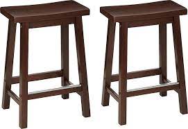 Photo 1 of * USED * 
Amazon Basics Solid Wood Saddle-Seat Kitchen Counter-Height Stool, 24-Inch Height, Walnut Finish - Set of 2