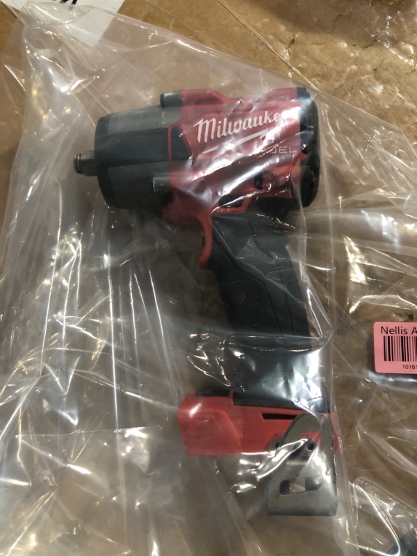 Photo 2 of **FOR PARTS OR REPAIR**
Milwaukee M18 FUEL Mid-Torque 3/8" Impact Wrench with Friction Ring - No Charger, No Battery, Bare Tool Only 
