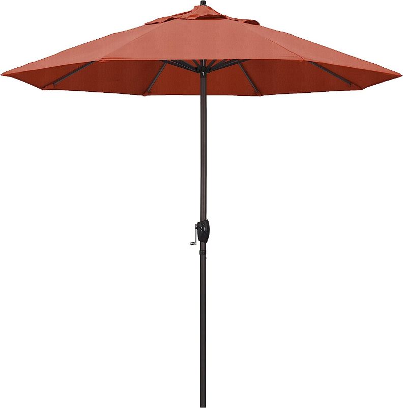 Photo 1 of *YELLOW , NEW* California Umbrella  Crank Lift, Auto Tilt, Bronze Pole, Patio Umbrella, 9' Round, Terracotta