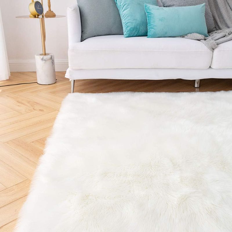 Photo 1 of  **** USED A BIT DIRTY BUT STILL  NICE NO STAINING Carvapet Shaggy Soft Faux Sheepskin Fur Area Rugs Floor Mat Luxury Beside Carpet for Bedroom Living Room 5ft x 7ft, White

