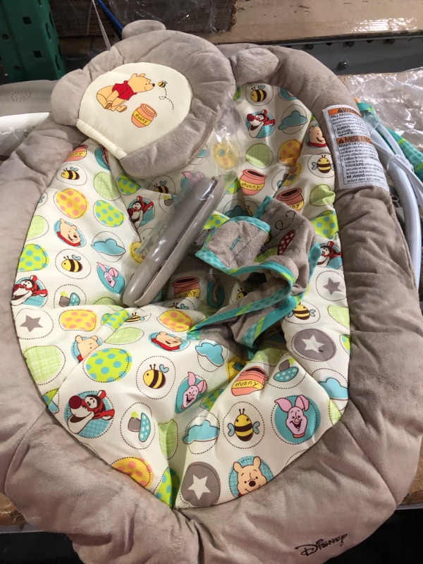 Photo 2 of Bright Starts Winnie the Pooh Dots & Hunny Pots Baby Bouncer with Vibrating Infant Seat, Music & 3 Playtime Toys, 23x19x23 Inch