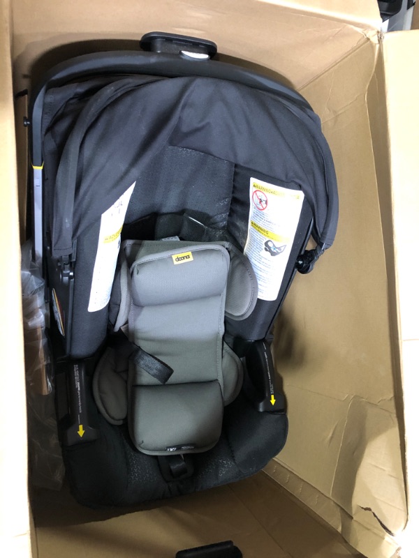 Photo 2 of Doona Infant Car Seat & Latch Base - Rear Facing -Car Seat to Stroller in Seconds - ***DIRTY COVER*** **SEE PHOTOS**