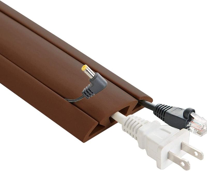 Photo 1 of BROWN 5 FT CORD PROTECTOR 3 CHANNEL 
