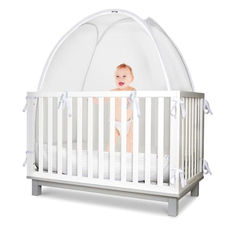 Photo 1 of  Baby Safety Crib Tent - Premium Toddler Crib Topper to Keep Baby from Climbing Out - See Through Mesh Crib Net - Mosquito Net - Pop-Up Crib Tent Canopy to Keep Infant in (White Wave)