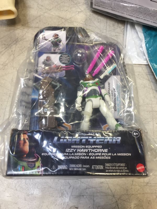 Photo 2 of Mattel Lightyear Toys Action Figure with Laser Strike Motion & Accessories, 5-in Scale Mission Equipped Izzy Hawthorne