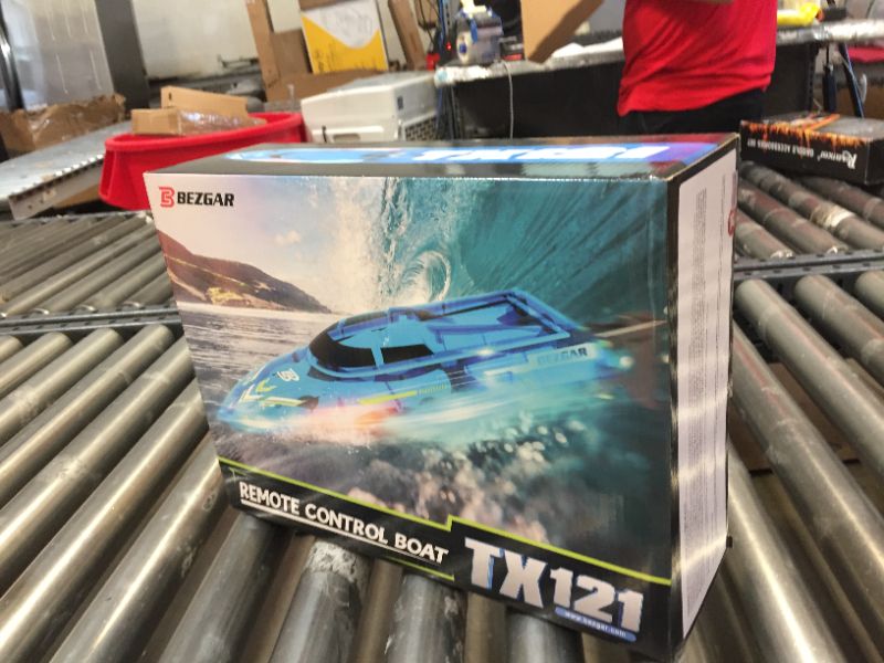 Photo 5 of BEZGAR TX121 RC Boat, Remote Control Boat for Pools and Lakes, 2.4GHz Racing RC Boats for Adults and Kids, Top Speed 20+MPH, Features with Transparent Cover and LED Effect, with Rechargeable Battery Blue-yellow