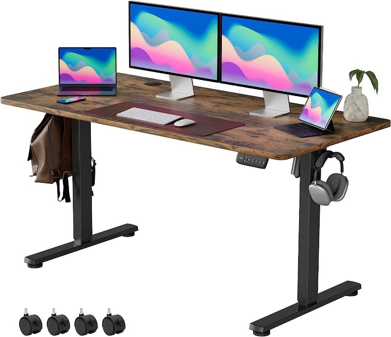 Photo 1 of VOSATRON Height Adjustable Electric Standing Desk, 55 x 24 Inches Sit Stand Up Desk with Splice Board, Memory Computer Home Office Desk with Caster Wheels, Black Frame/Rustic Brown Top
