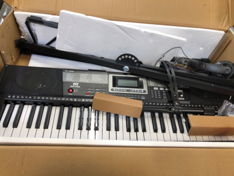 Photo 2 of MUSTAR 61 Key Piano Keyboard, Learning Keyboard Piano with Lighted Up Keys, Electric Piano Keyboard for Beginners, Piano Stand, Sustain Pedal, Headphones/Microphone, USB Midi, Built-in Speakers
