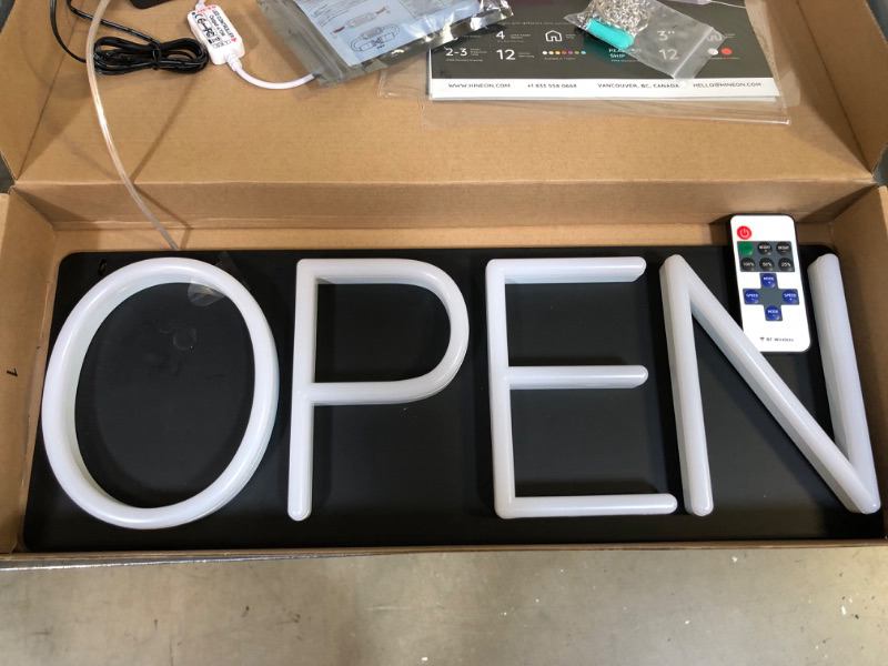 Photo 2 of HiNeon Neon Open Sign 20inx7in LED Open Sign w/Remote Controller, Electric Light Up Open Sign for Business Store, w/Hanging Chain for Shop Windows, Direct Plug-In w/ 12V Power Adapter, White  *** ITEM WOULD NOT TURN ON ***