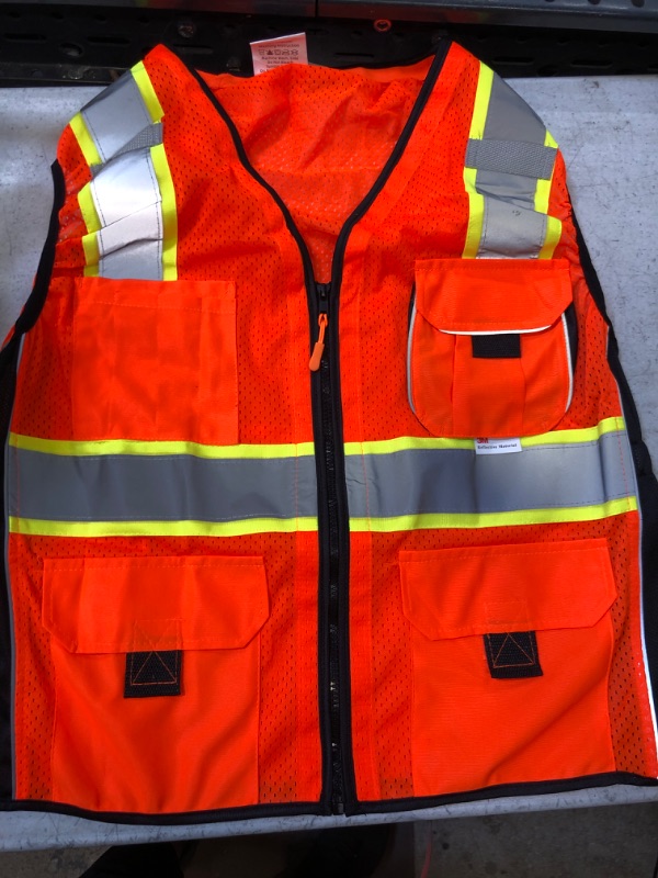 Photo 2 of Dib Safety Vest for Women with Pockets, Mesh Reflective Vest High Visibility, ANSI Class 2 Made with 3M Reflective Tape, Orange and Black XL
