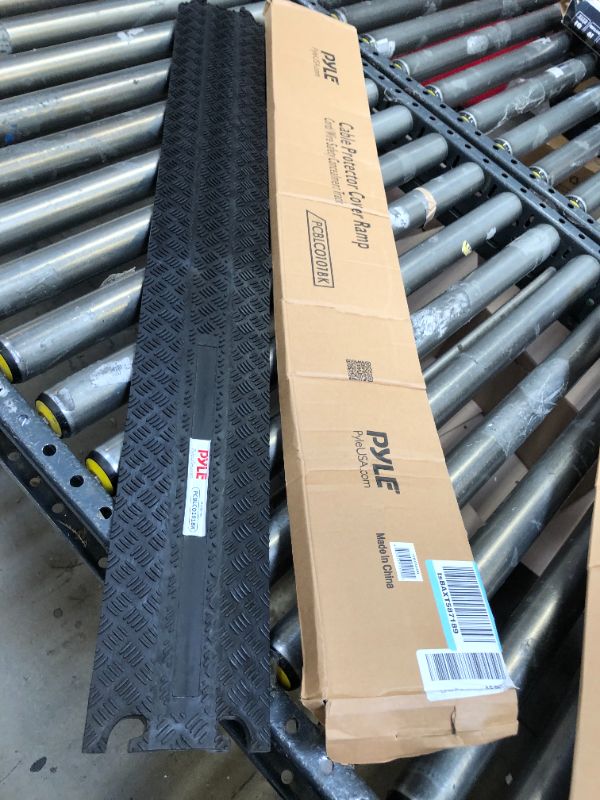 Photo 1 of Durable Cable Protection Ramp Cover - Supports 11000lbs Single Channel Heavy Duty Hose and Cord Track Floor Protection, 39.4” x 5.11” x 0.78” Cable Concealer for Indoor Outdoor Use - Pyle PCBLCO101BK