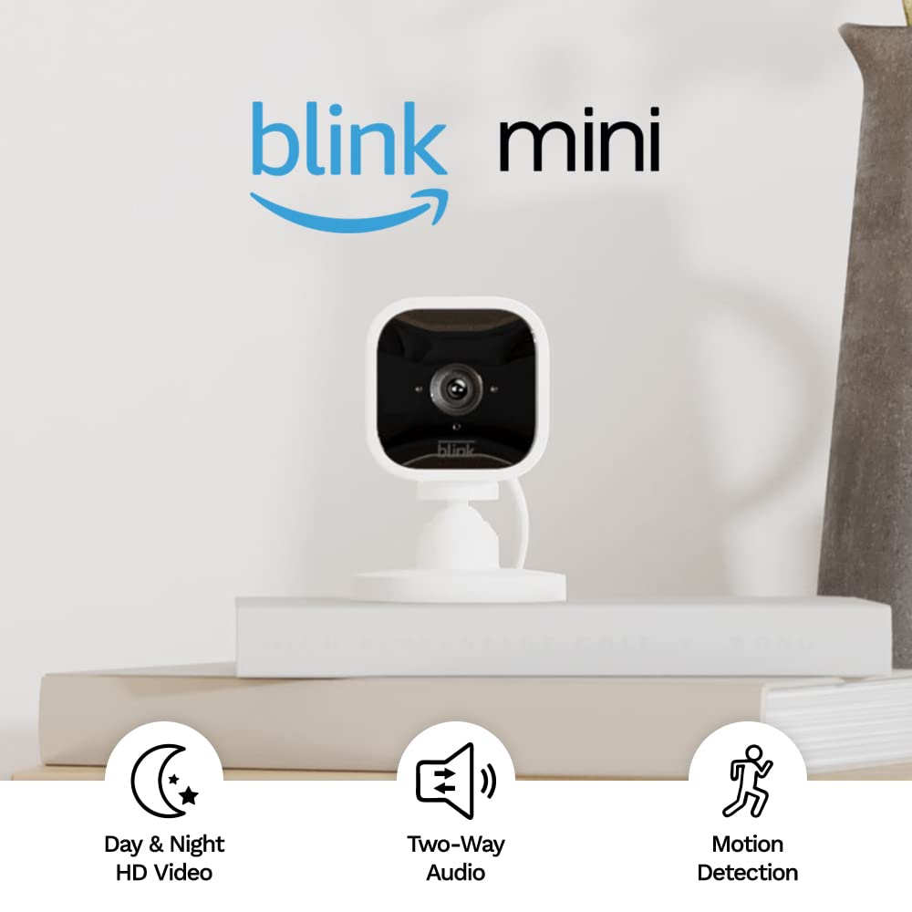 Photo 1 of Blink Mini – Compact indoor plug-in smart security camera, 1080p HD video, night vision, motion detection, two-way audio, easy set up, Works with Alexa – 1 camera (White) White 1 Camera FACTORY SEALED)